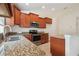 Well-equipped kitchen with granite counters, stainless steel oven and a convenient sink at 18710 Dobson Dr, Hudson, FL 34667