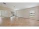 Bright open-plan living area with tiled floors and sliding glass doors to the outside at 18710 Dobson Dr, Hudson, FL 34667