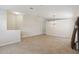 Spacious living room with neutral tile flooring and a chandelier, perfect for gatherings at 18710 Dobson Dr, Hudson, FL 34667