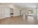Expansive living area with tile flooring, featuring seamless indoor-outdoor living at 18710 Dobson Dr, Hudson, FL 34667