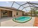 Backyard features a screened-in pool with ladder and deck space at 18710 Dobson Dr, Hudson, FL 34667