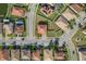A home sits with a terracotta roof, neatly fenced yard, and landscaping among similar neighborhood homes at 19082 Umberland Pl, Land O Lakes, FL 34638