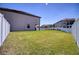 Wide backyard with lush lawn and border fence perfect for recreation and entertainment at 19082 Umberland Pl, Land O Lakes, FL 34638