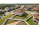 Aerial view of a home with a spacious fenced backyard and a small covered patio at 19082 Umberland Pl, Land O Lakes, FL 34638
