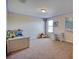 Spacious bedroom featuring light and a desk, complete with a cozy ambiance for restful nights and productive days at 19082 Umberland Pl, Land O Lakes, FL 34638