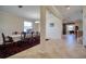 Spacious dining room with tile floors, a large window, and a view into an adjacent living area at 19082 Umberland Pl, Land O Lakes, FL 34638