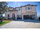 Charming home featuring stone accents and a paver driveway leading to the garage at 19082 Umberland Pl, Land O Lakes, FL 34638