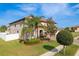 Well-maintained home featuring a paver driveway and lush landscaping at 19082 Umberland Pl, Land O Lakes, FL 34638