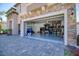 View of the large two car garage featuring epoxy flooring and ample storage at 19082 Umberland Pl, Land O Lakes, FL 34638