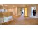 Spacious hallway with carpeted floors and several doorways leading to other rooms at 19082 Umberland Pl, Land O Lakes, FL 34638