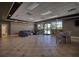 Large community lounge with comfortable seating, tables, and plenty of natural light at 19082 Umberland Pl, Land O Lakes, FL 34638