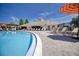 Outdoor pool with sundeck, lounge chairs, and clubhouse in a community setting at 19082 Umberland Pl, Land O Lakes, FL 34638