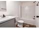 Clean, well-lit bathroom with a shower-tub combination, toilet, and a vanity with storage at 20064 Manecke Rd, Brooksville, FL 34601