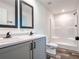 Modern bathroom with double sinks, new fixtures, and a spacious shower at 20064 Manecke Rd, Brooksville, FL 34601
