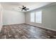 Inviting bedroom featuring hardwood floors, neutral walls, and ample natural light at 20064 Manecke Rd, Brooksville, FL 34601