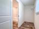This is a walk-in closet with an adjoining bathroom with a white shower, providing ample storage at 20064 Manecke Rd, Brooksville, FL 34601