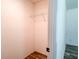 Empty walk-in closet with wood-look flooring and wire shelving unit at 20064 Manecke Rd, Brooksville, FL 34601