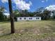 Charming single-story home with manicured lawn and classic architectural design at 20064 Manecke Rd, Brooksville, FL 34601