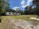 Inviting single-story home with a well-maintained exterior and scenic surroundings at 20064 Manecke Rd, Brooksville, FL 34601