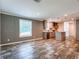 Bright, open kitchen featuring gray cabinets, an island, and modern recessed lighting at 20064 Manecke Rd, Brooksville, FL 34601