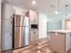 Well-equipped kitchen featuring stainless steel appliances and gray cabinetry for a sleek look at 20064 Manecke Rd, Brooksville, FL 34601
