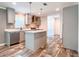 Stylish kitchen with gray cabinets, stainless steel appliances, and a functional island for meal prep at 20064 Manecke Rd, Brooksville, FL 34601