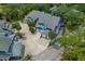 The blue exterior pops in this aerial view of the buildings with ample parking and mature landscaping at 2026 Golfview Dr # 2026, Tarpon Springs, FL 34689