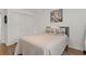 Cozy bedroom featuring wood floors, neutral décor, and a comfortable bed at 2026 Golfview Dr # 2026, Tarpon Springs, FL 34689