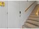 The home's entryway leads to a staircase with a wood handrail at 2026 Golfview Dr # 2026, Tarpon Springs, FL 34689