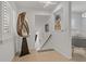 Hallway showcasing white walls, artistic décor, and tiled floors leading to a dining area at 2026 Golfview Dr # 2026, Tarpon Springs, FL 34689