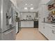 Bright kitchen featuring stainless steel appliances, stylish countertops, and lots of storage at 2026 Golfview Dr # 2026, Tarpon Springs, FL 34689