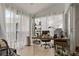 Bright sunroom with tiled floors, comfortable seating, and plenty of natural light at 2026 Golfview Dr # 2026, Tarpon Springs, FL 34689