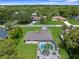 Ariel view of home showing fully screened pool and mature landscaping at 2122 Meadow Lark Rd, Spring Hill, FL 34608