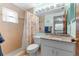 Bathroom featuring tile shower, granite countertops and vanity sink at 2122 Meadow Lark Rd, Spring Hill, FL 34608