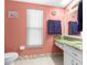 Well-lit bathroom with bright vanity, convenient sink space and ample storage options at 2122 Meadow Lark Rd, Spring Hill, FL 34608
