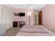Comfortable bedroom with soft lighting, entertainment TV, and functional storage solutions at 2122 Meadow Lark Rd, Spring Hill, FL 34608