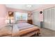Cozy bedroom features a bright window and ample closet space for convenient storage at 2122 Meadow Lark Rd, Spring Hill, FL 34608