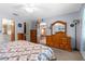 Bedroom with a dresser with mirror and doorway to other rooms at 2122 Meadow Lark Rd, Spring Hill, FL 34608