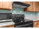Updated kitchen features stainless steel appliances and granite countertops at 2122 Meadow Lark Rd, Spring Hill, FL 34608