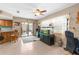 Bright living room features a ceiling fan, tile floors, and an aquarium at 2122 Meadow Lark Rd, Spring Hill, FL 34608