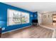 Bright living room featuring wood-look flooring and a large window at 2122 Meadow Lark Rd, Spring Hill, FL 34608