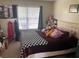 A neatly arranged bedroom with a comfortable bed, offering a cozy and restful environment at 2850 Westmoreland Ct, New Port Richey, FL 34655