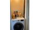 A practical laundry area features a modern washer, perfect for efficient laundry care at 2850 Westmoreland Ct, New Port Richey, FL 34655