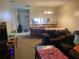 Cozy living room with plush seating and view into the dining area at 2850 Westmoreland Ct, New Port Richey, FL 34655