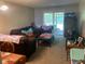 Comfortable living room featuring a large sectional couch and sliding doors to the patio at 2850 Westmoreland Ct, New Port Richey, FL 34655