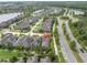 Neighborhood aerial view shows home's location near a lake, roads, and other homes at 3056 Abrams Trl, Odessa, FL 33556