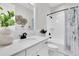 Stylish bathroom featuring a single sink vanity, a decorative mirror, and a shower with a shower curtain at 3056 Abrams Trl, Odessa, FL 33556