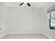 Neutral bedroom with carpet, ceiling fan and large window providing natural light at 3056 Abrams Trl, Odessa, FL 33556