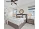 Comfortable bedroom with a ceiling fan and natural light at 3056 Abrams Trl, Odessa, FL 33556