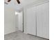 Clean bedroom featuring three closets, carpeted floors and neutral tones at 3056 Abrams Trl, Odessa, FL 33556